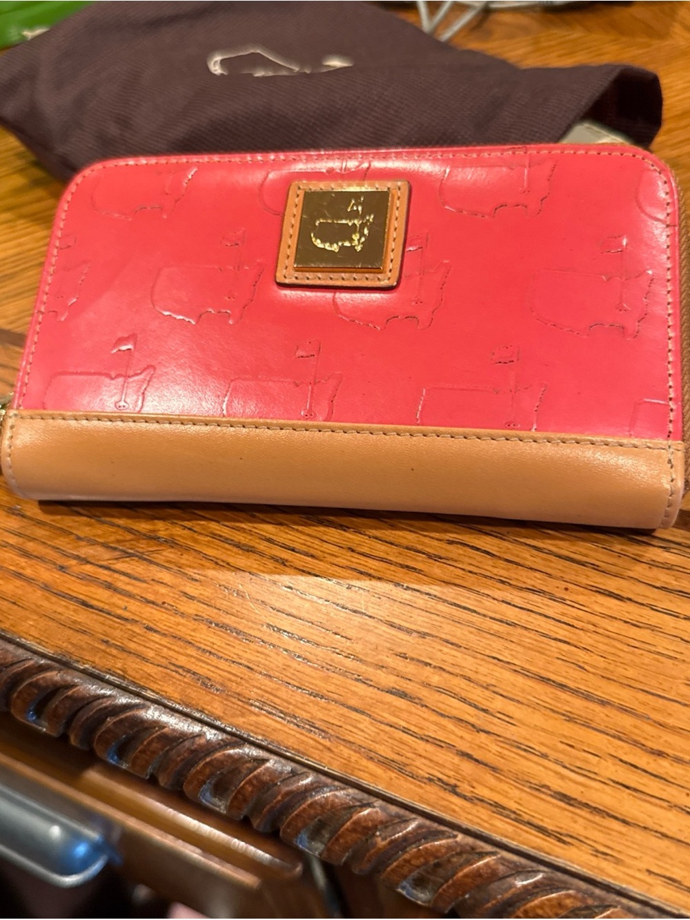 Dooney & Bourke Pink-Red Leather Zip Around Wallet with Tan Trim
